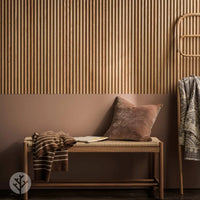 Flutto™ Oak Zigzag flexible wood panels featured in a stylish interior setting with bench and accessories.