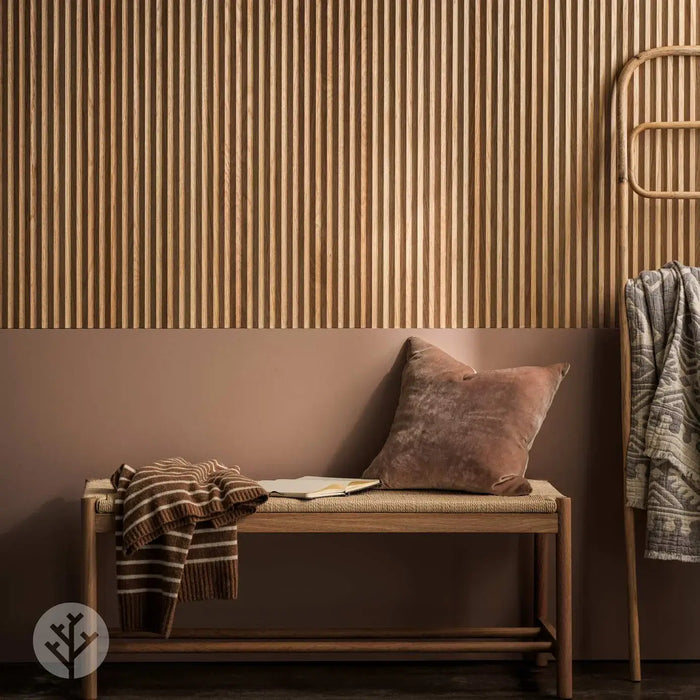 Flutto™ Oak Zigzag flexible wood panels featured in a stylish interior setting with bench and accessories.