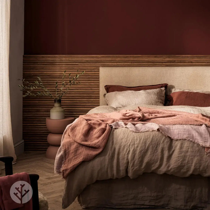 Cozy bedroom featuring Flutto™ Walnut Zigzag Flexible Tambour Wood Panels as a headboard accent.