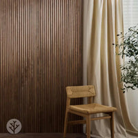 Flutto™ Walnut Zigzag flexible wood panels create a stylish backdrop, enhancing any interior space with texture and warmth.