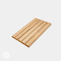 Flutto™ flexible panel sample box showcasing natural timber layers with distinctive grain patterns.