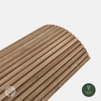 Flutto™ Walnut Slat Flexible Tambour Wood Panels showcasing how their classic slat pattern in warm walnut finish is able to freely bend around a curve.
