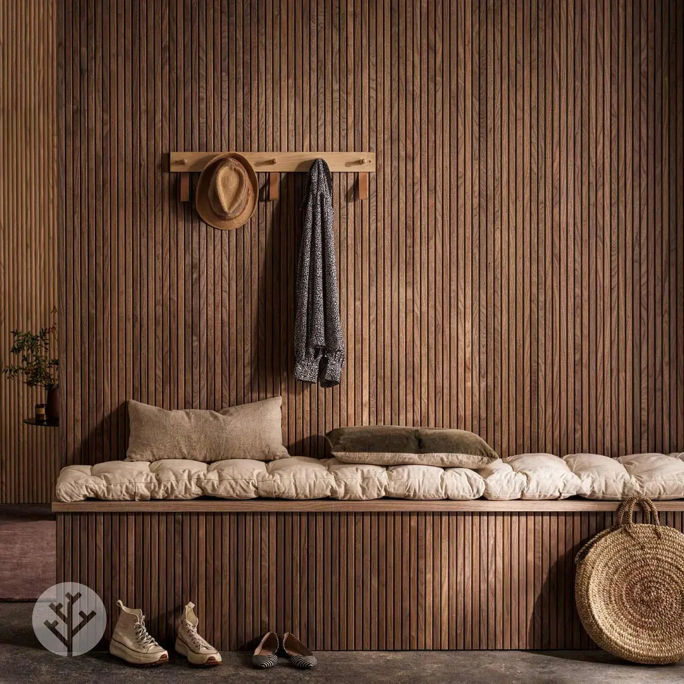 Flutto™ walnut slat wood panels in a modern interior with cozy seating and decor.